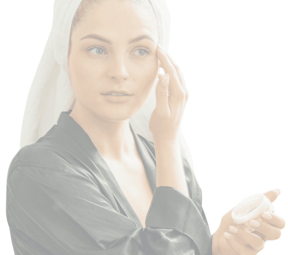 Landing Page Image For Absolute Dermatology. A picture of a woman applying lotion to her face